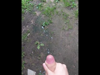 Cumming near an abandoned building