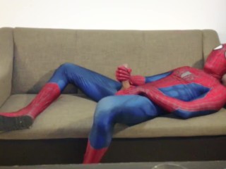Horny Spiderman jerks off and cums massive load